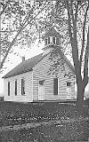 Built in 1894 as an Adventist Christian Church building, it was later purchased and enlarged by the Grace Evangelical United Brethren church congregation. It is now an insurance office on Monticello's East Lake Ave.